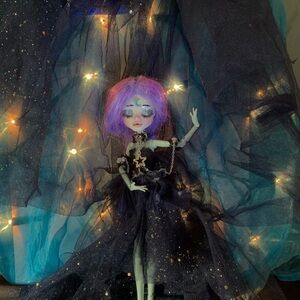 Enchanting Doll with Purple Hair and Starry Dress